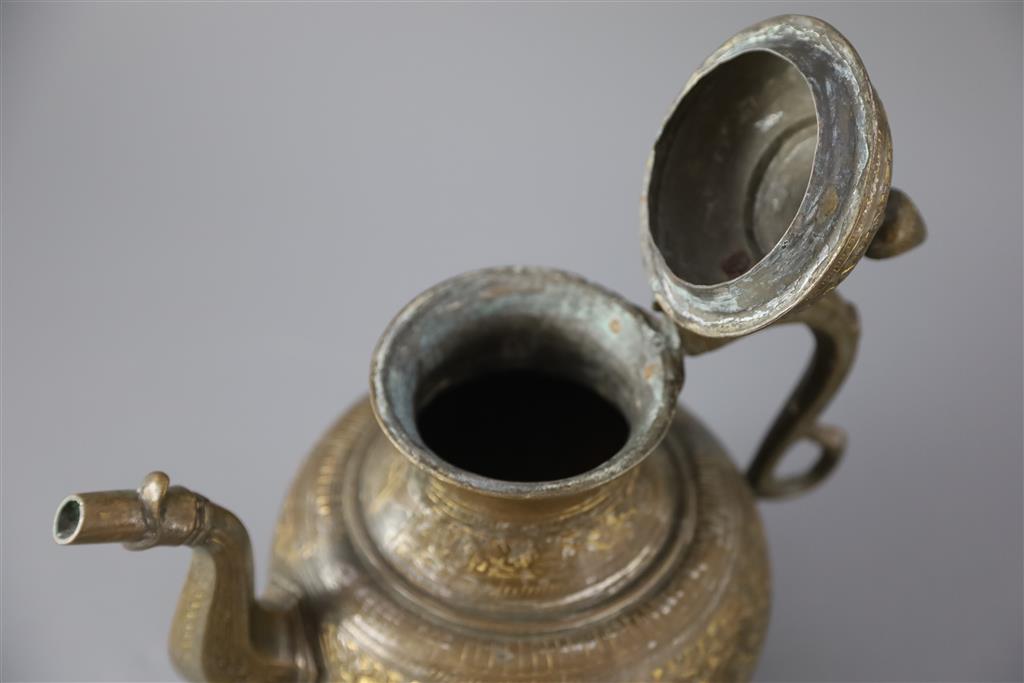 An 18th century Mughal Indian bronze and parcel gilt ewer, 26cm high